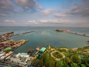 High angle view of sea and buildings against sky