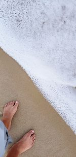 Water line drawn in the sand