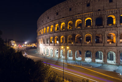 Illuminated coliseum at night
