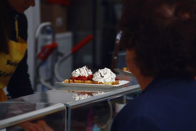 Close-up of man in plate on table