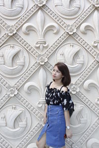 Full length of woman standing at home