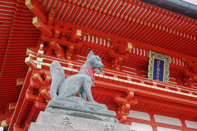 Statue of temple outside building