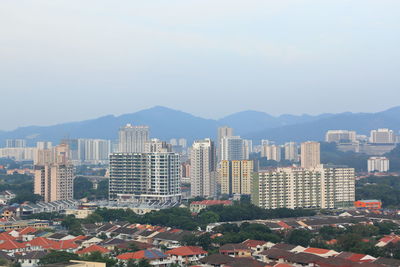 High angle view of buildings in city against clear sky