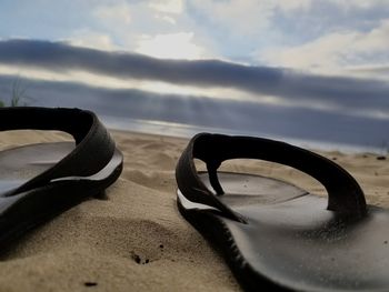 Close-up of beach against sky