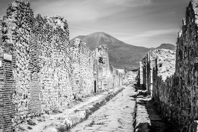 Panoramic view of road leading towards mountains against sky