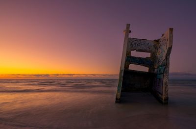 Scenic view of beach at sunset