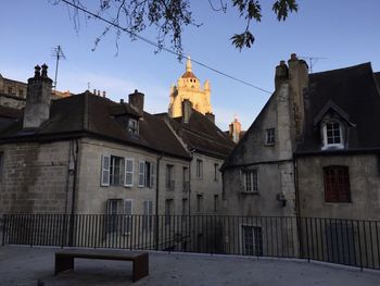 Low angle view of buildings against sky in city