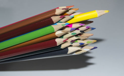 Close-up of multi colored pencils on table