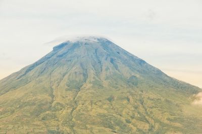 Scenic view of volcanic mountain against sky