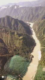 High angle view of river amidst mountains