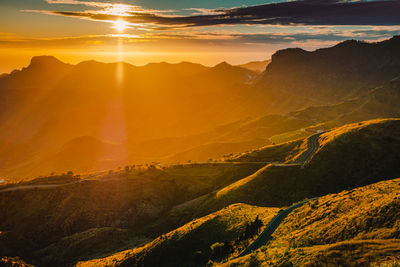 Scenic view of mountains against sky during sunset
