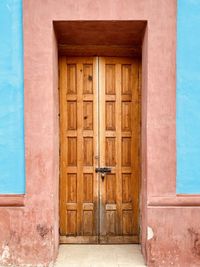 Closed wooden door of building