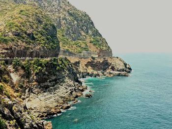 Scenic view of sea and rock formation against sky