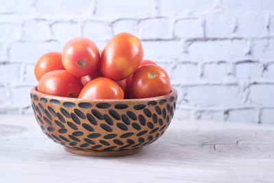 Close-up of fruits in basket on table