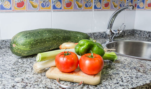 Tomatoes in container at home