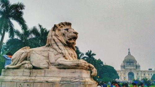 Low angle view of statue against sky