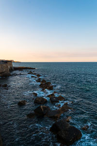 Scenic view of sea against clear sky