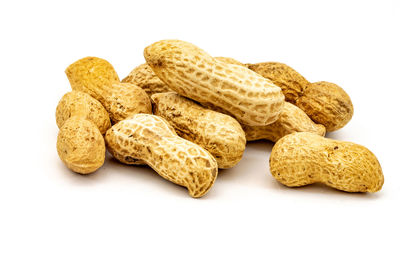 Close-up of peanuts against white background