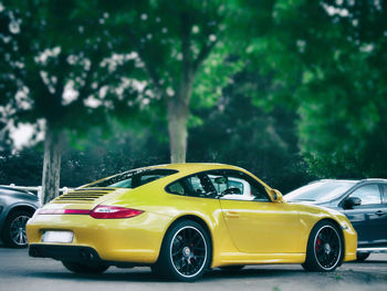 Yellow toy car in park