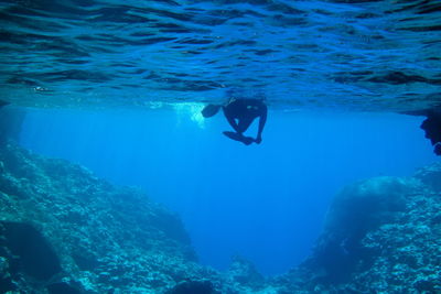 Person swimming undersea