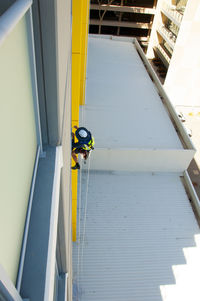 High angle view of yellow staircase by building