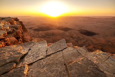 Aerial view of rocks at sunset