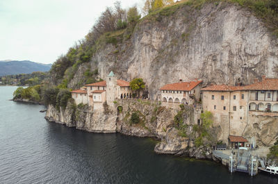 Drone view at the monastery of santa caterina del sasso on lake maggiore italy
