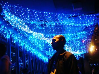 Man standing at night