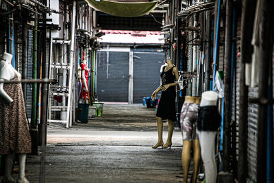 Rear view of people standing on street