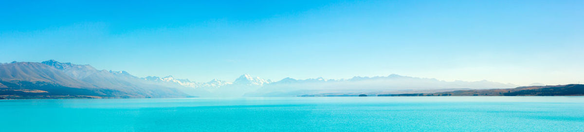 Scenic view of lake against blue sky