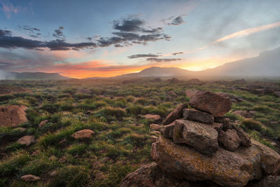 Scenic view of landscape against sky during sunset