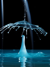 Close-up of water splashing on black background