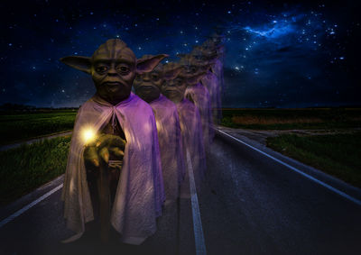 Digital composite image of people standing on road at night