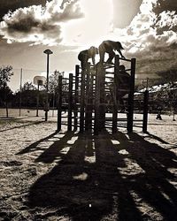 View of street light against cloudy sky
