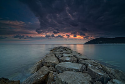 Scenic view of sea against sky at sunset