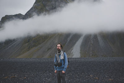 Portrait of man standing on mountain