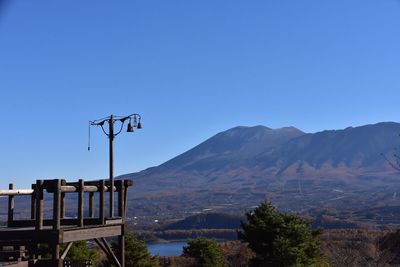 Scenic view of mountains against clear blue sky