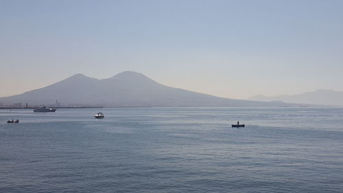 Scenic view of sea with mountains in background