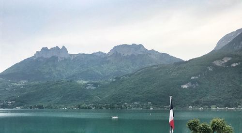 Scenic view of mountains and lake against sky