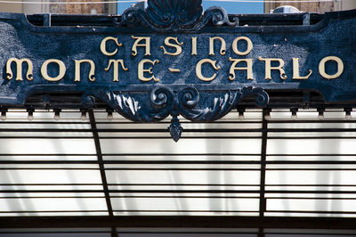 Close-up of text on metal railing