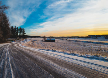 Scenic view of field against sky during sunset