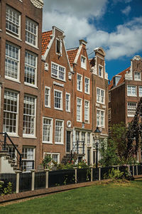 Row typical houses and garden at the begijnhof in amsterdam. the netherland capital full of canals.