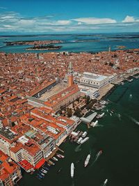 High angle view of sea against buildings in city