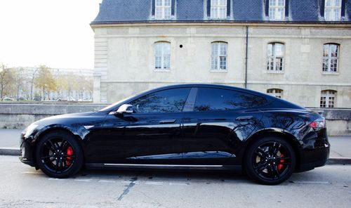 Car parked on street against building