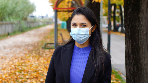 Young woman wearing mask