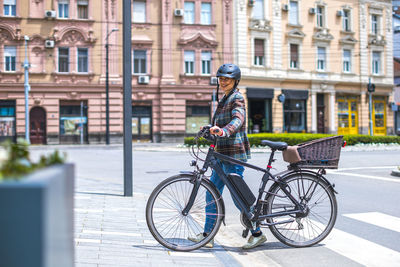 Man riding bicycle on street