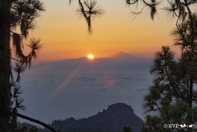 Scenic view of silhouette mountains against sky during sunset