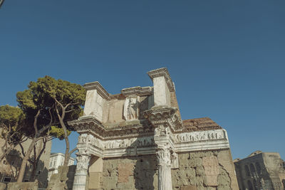 Low angle view of historic building against clear blue sky