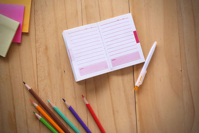 High angle view of colored pencils on table