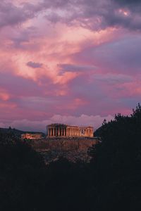 Parthenon against sky during sunset